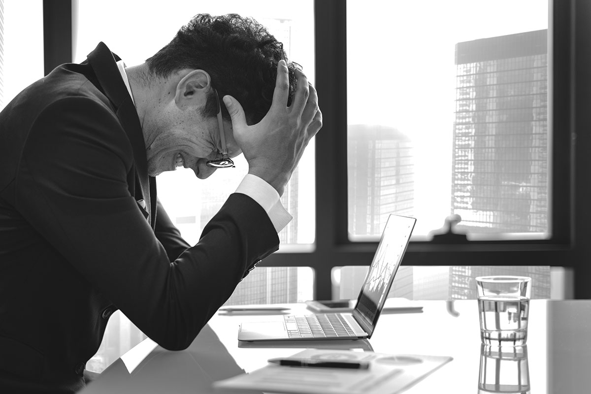 stressed-young-businessman-overworking2